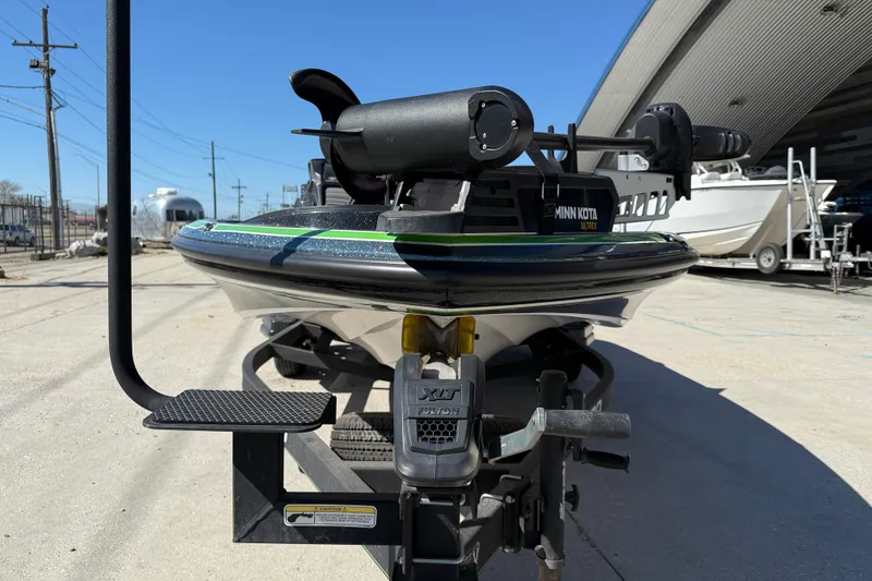 Slide: The Image of 2020 Nitro Z20 boat with Minn Kota Ultrex motor on trailer, parked outdoors. - 3