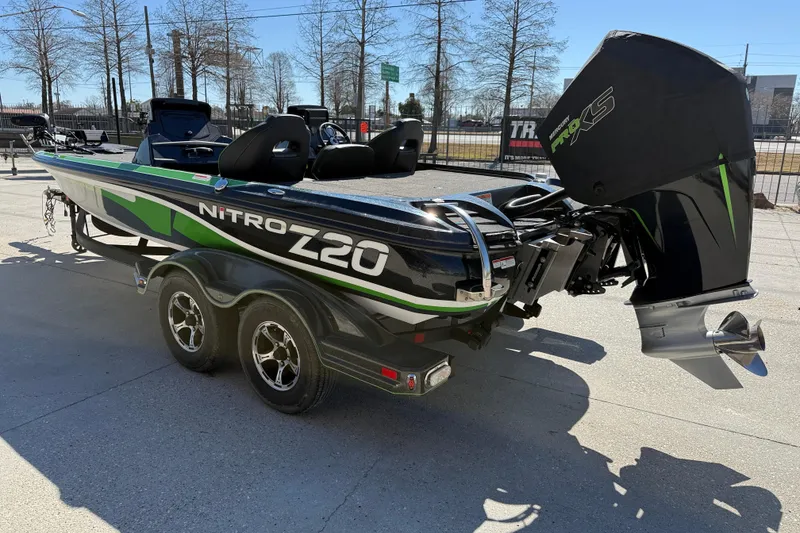 Slide: The Image of 2020 Nitro Z20 boat with sleek design and powerful engine on a trailer. - 5