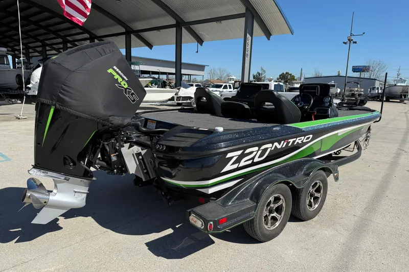 Slide: The Image of 2020 Nitro Z20 boat with Mercury Pro XS engine, parked under a canopy. - 7