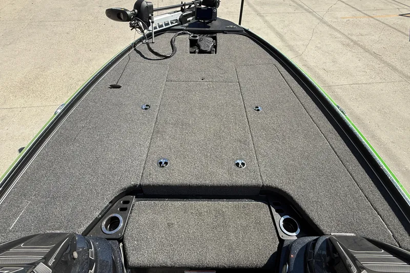 Slide: The Image of 2020 Nitro Z20 boat deck with carpeted surface and fishing equipment. - 9