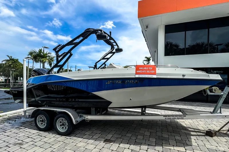 Slide: The Image of 2024 Starcraft SVX 211 OB boat on trailer, available for immediate delivery. - 1