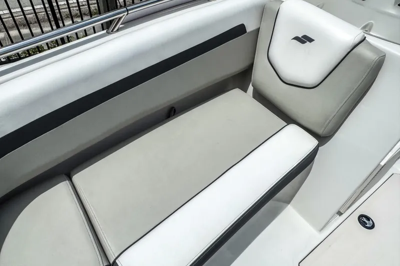 Slide: The Image of 2024 Starcraft SVX 211 OB boat interior seating with sleek design and comfortable upholstery. - 12