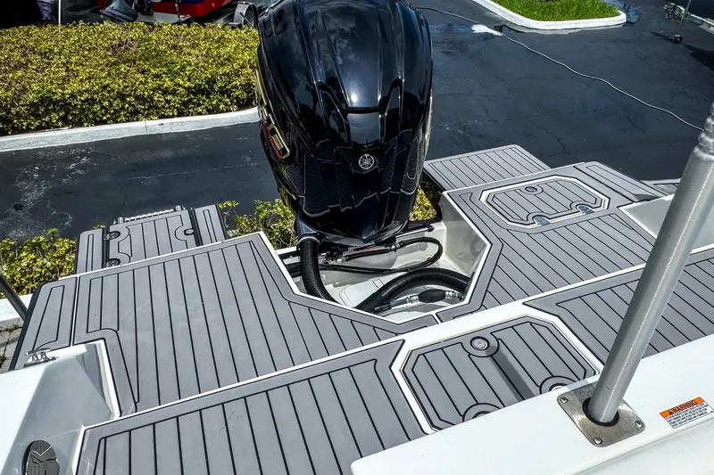 Slide: The Image of 2024 Starcraft SVX 211 OB boat with sleek outboard motor and modern deck design. - 5