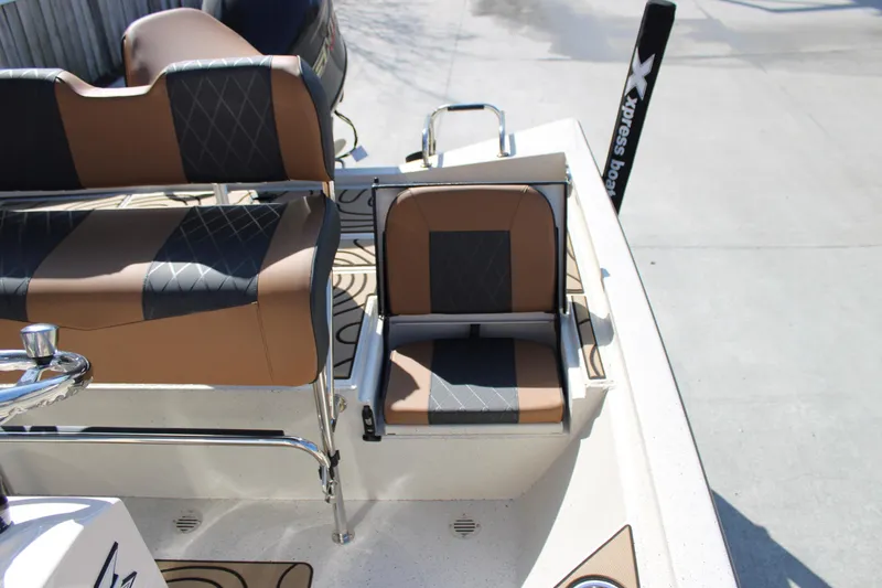 Slide: The Image of 2026 Xpress H20B Bay boat with stylish seating and modern design. - 13