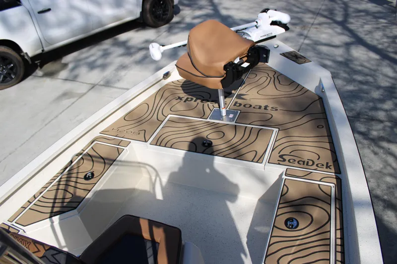 Slide: The Image of 2026 Xpress H20B Bay boat with SeaDek flooring and a comfortable seat. - 7