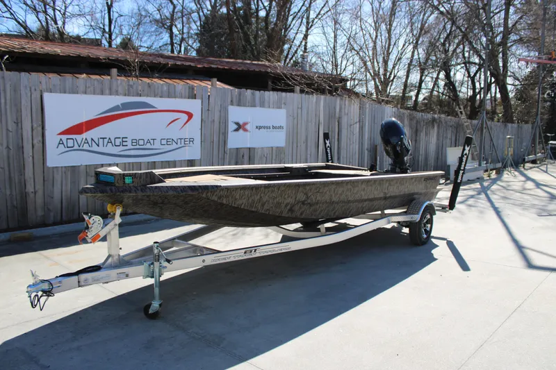 Slide: The Image of 2026 Xpress X18DB boat on trailer at Advantage Boat Center. - 3