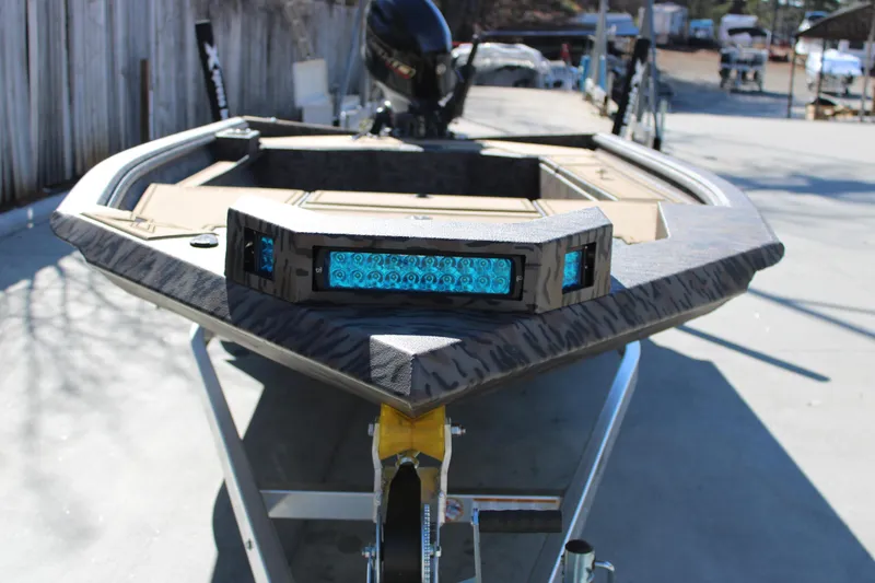 Slide: The Image of 2026 Xpress X18DB boat with LED lights on trailer, outdoor setting. - 4