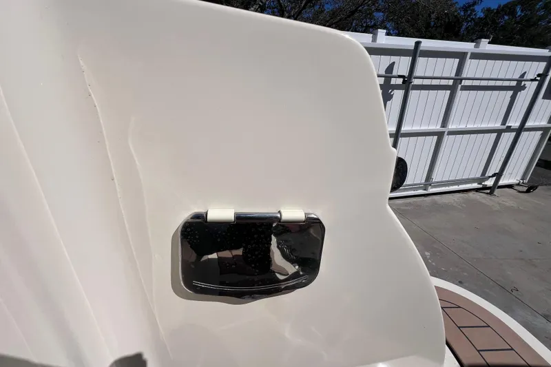 Slide: The Image of 2022 Chris-Craft Catalina 30 boat detail with chrome fixture, outdoor setting. - 11