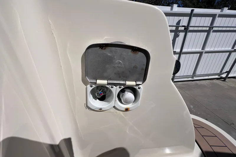 Slide: The Image of 2022 Chris-Craft Catalina 30 boat detail with open utility compartment. - 12