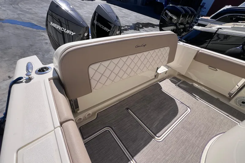 Slide: The Image of 2022 Chris-Craft Catalina 30 boat interior with Mercury engines, featuring elegant seating and flooring. - 15