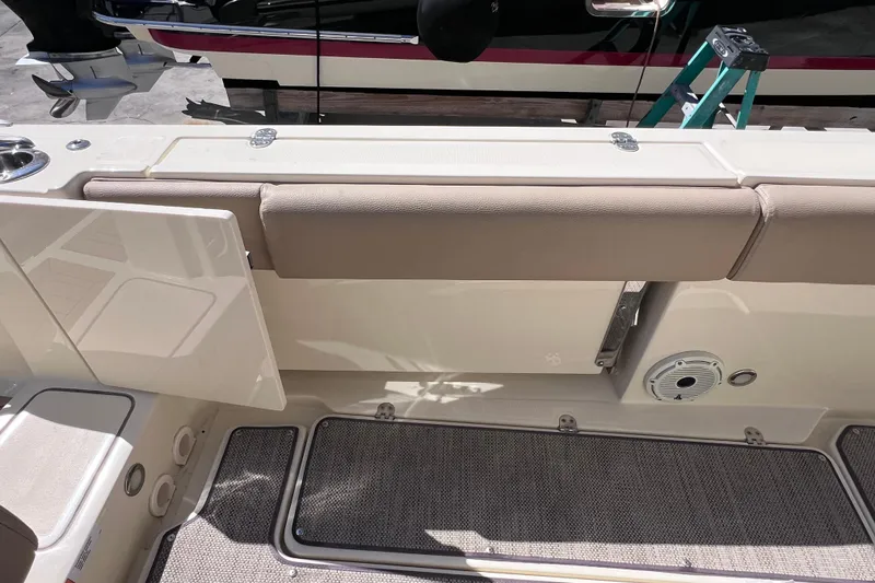Slide: The Image of 2022 Chris-Craft Catalina 30 interior detail with beige seating and deck features. - 19