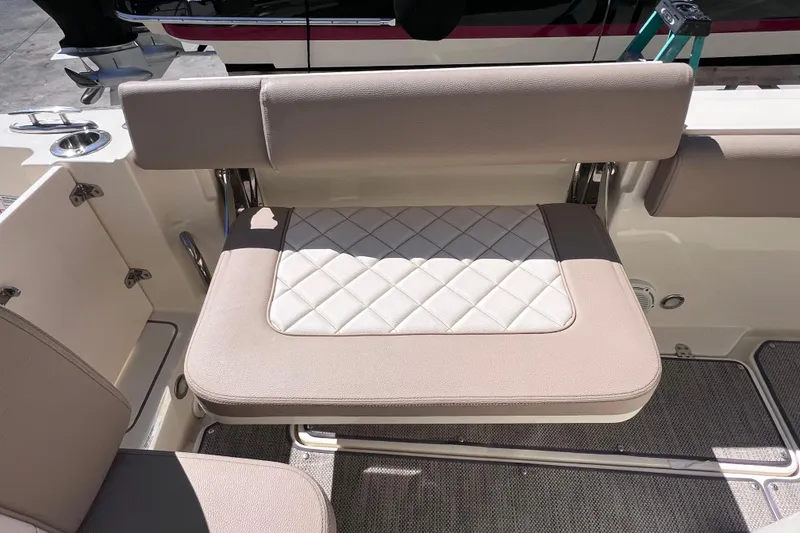 Slide: The Image of 2022 Chris-Craft Catalina 30 boat seat with beige and white diamond-patterned upholstery. - 20