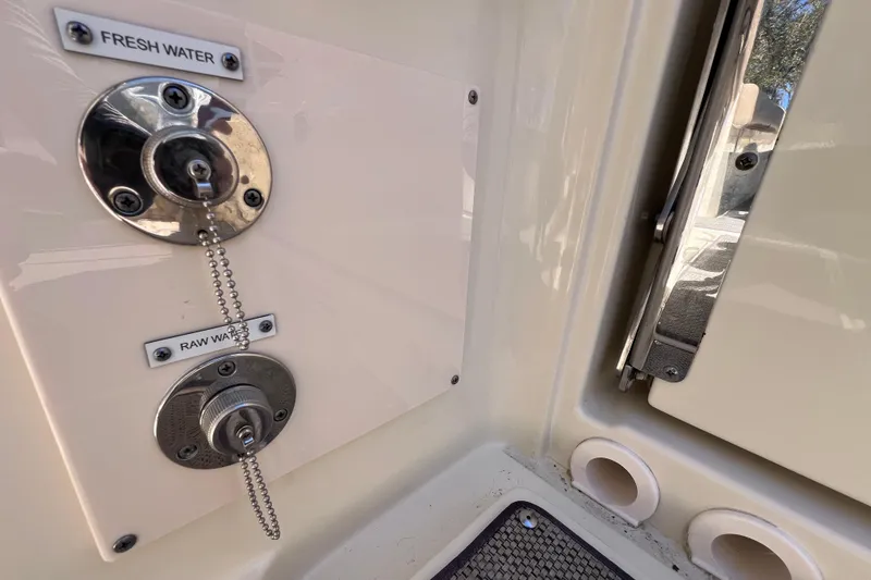 Slide: The Image of 2022 Chris-Craft Catalina 30 water connections labeled "Fresh Water" and "Raw Water." - 24