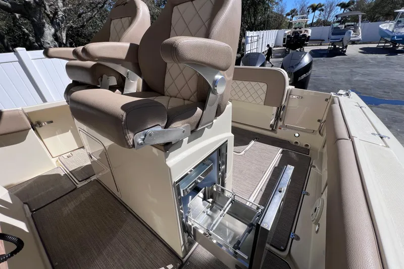 Slide: The Image of 2022 Chris-Craft Catalina 30 interior with luxurious seating and storage features. - 28