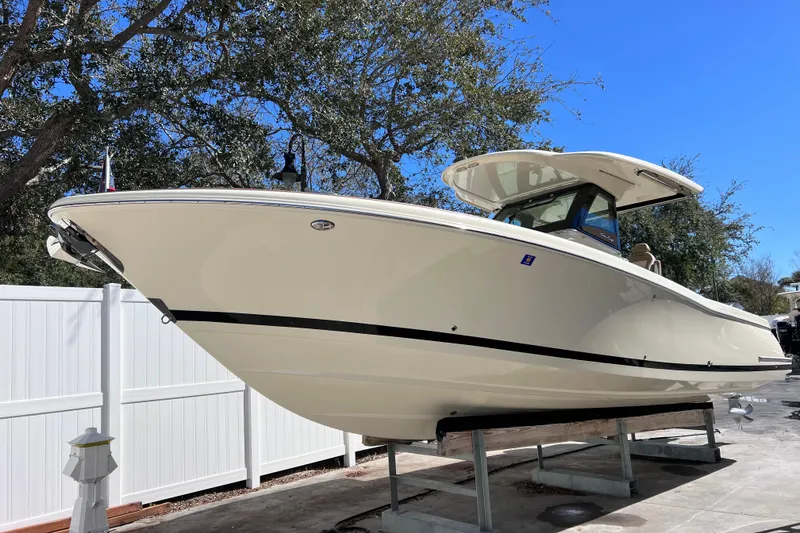 Slide: The Image of 2022 Chris-Craft Catalina 30 boat displayed outdoors on a sunny day. - 3