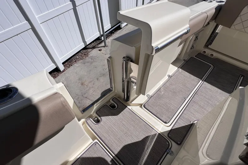 Slide: The Image of 2022 Chris-Craft Catalina 30 interior with beige seating and non-slip flooring. - 30