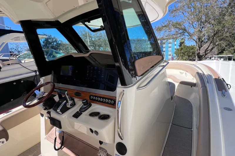 Slide: The Image of 2022 Chris-Craft Catalina 30 helm with modern controls and luxurious seating. - 32
