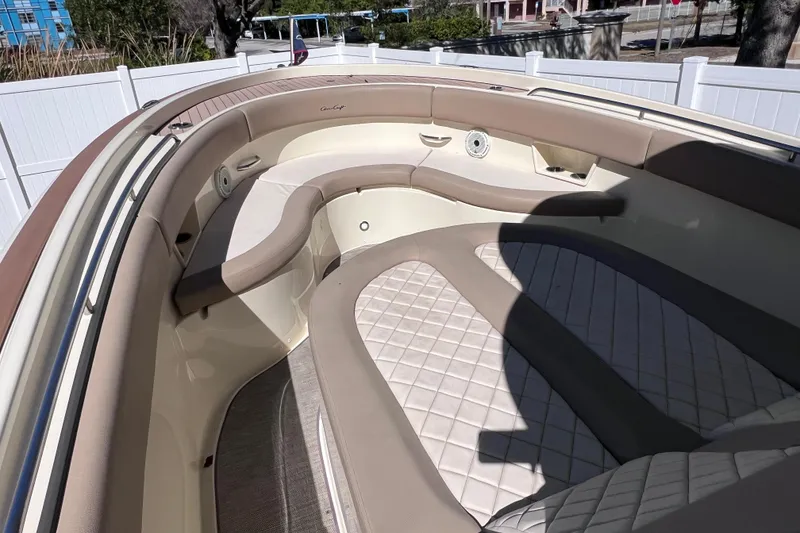 Slide: The Image of 2022 Chris-Craft Catalina 30 interior with beige seating and quilted cushions. - 40