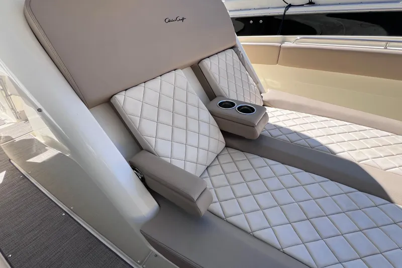 Slide: The Image of Luxurious seating on 2022 Chris-Craft Catalina 30 boat with quilted upholstery and cup holders. - 45