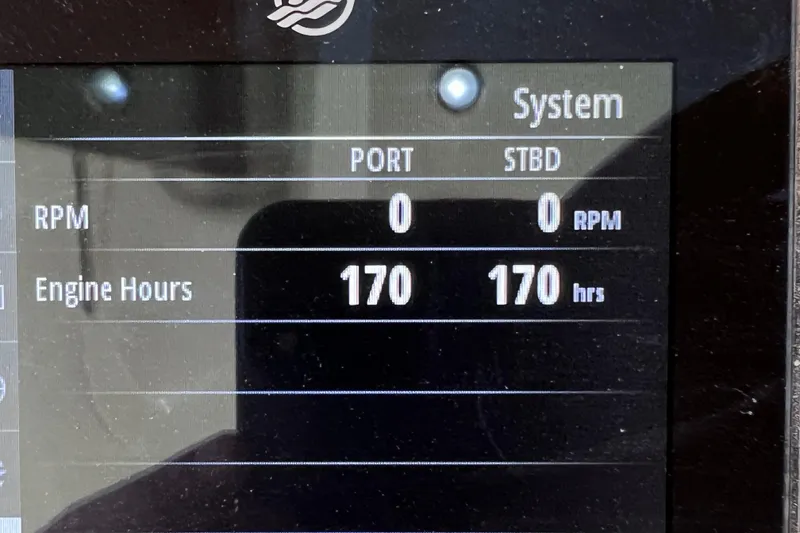 Slide: The Image of Display panel of 2022 Chris-Craft Catalina 30 showing 170 engine hours for both engines. - 47