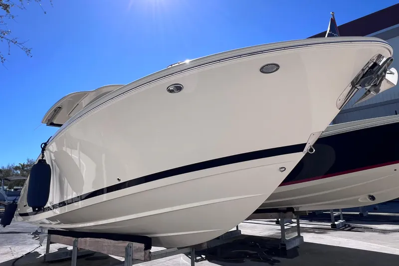 Slide: The Image of 2022 Chris-Craft Catalina 30 boat on display under clear blue sky. - 5