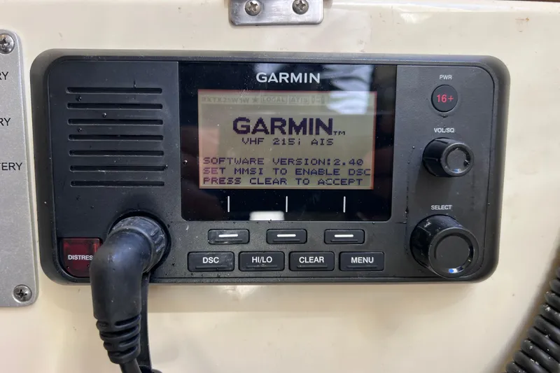 Slide: The Image of Garmin VHF 215 AIS radio on 2022 Chris-Craft Catalina 30 boat dashboard. - 52
