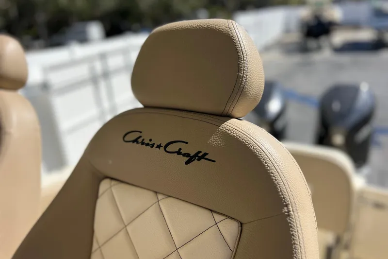 Slide: The Image of Luxurious beige seat of 2022 Chris-Craft Catalina 30 boat with logo. - 55