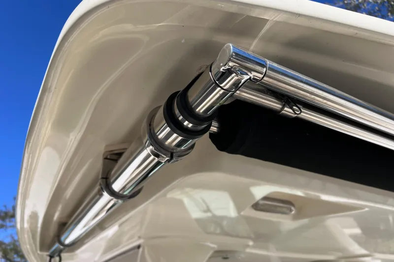 Slide: The Image of Stainless steel fittings on 2022 Chris-Craft Catalina 30 boat, under clear blue sky. - 56