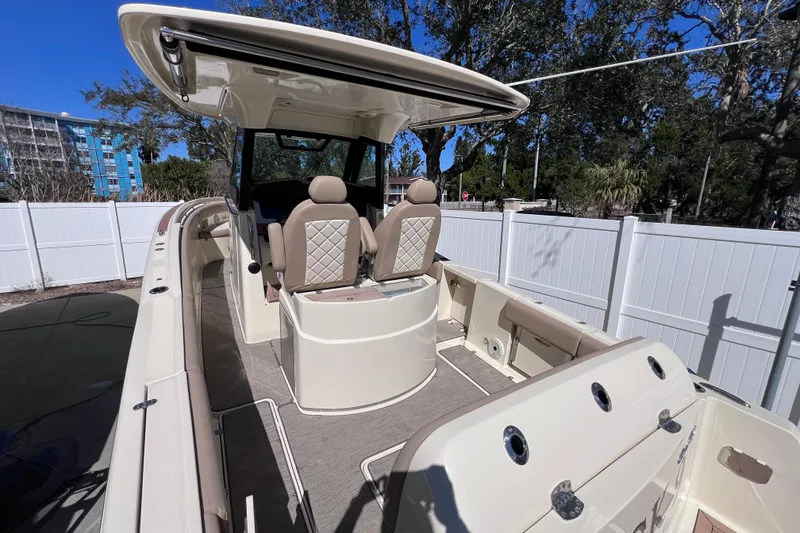 Slide: The Image of 2022 Chris-Craft Catalina 30 boat interior with seating and helm, outdoors. - 8