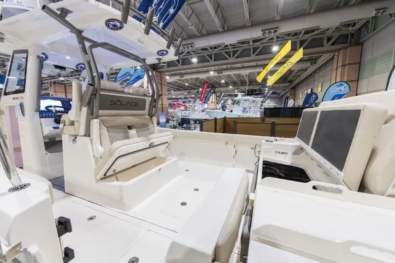 Slide: The Image of 2026 Solace 30 CS boat interior at a boat show, showcasing seating and design features. - 9