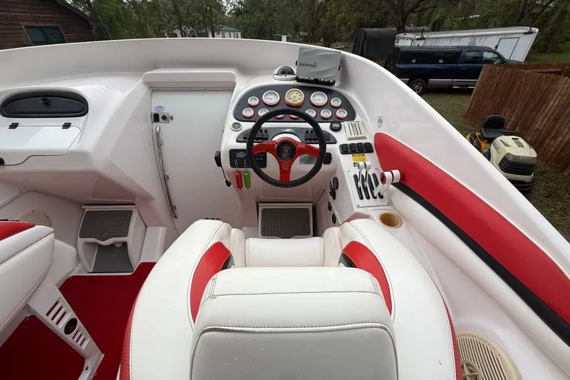 Slide: The Image of Cockpit of a 1998 Donzi 33 ZX boat with red and white interior. - 14