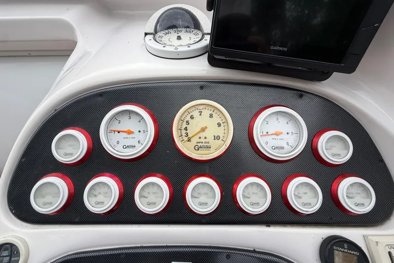 Slide: The Image of Dashboard of a 1998 Donzi 33 ZX boat with gauges and Garmin device. - 21