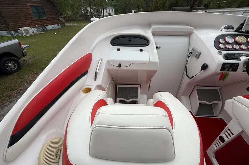 Slide: The Image of Interior of a 1998 Donzi 33 ZX boat with red and white seating. - 25