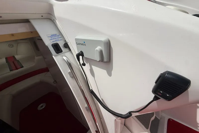 Slide: The Image of Interior of a 1998 Donzi 33 ZX boat featuring Garmin equipment and communication device. - 28