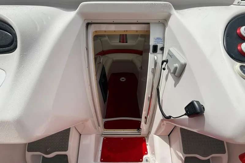 Slide: The Image of 1998 Donzi 33 ZX boat interior with red and white cabin design. - 29