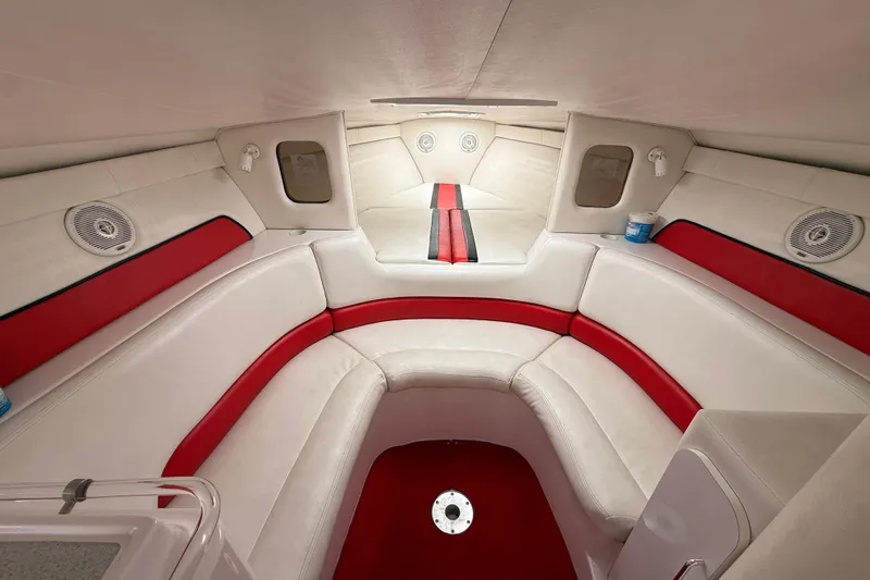 Slide: The Image of Interior of a 1998 Donzi 33 ZX boat with red and white seating. - 31