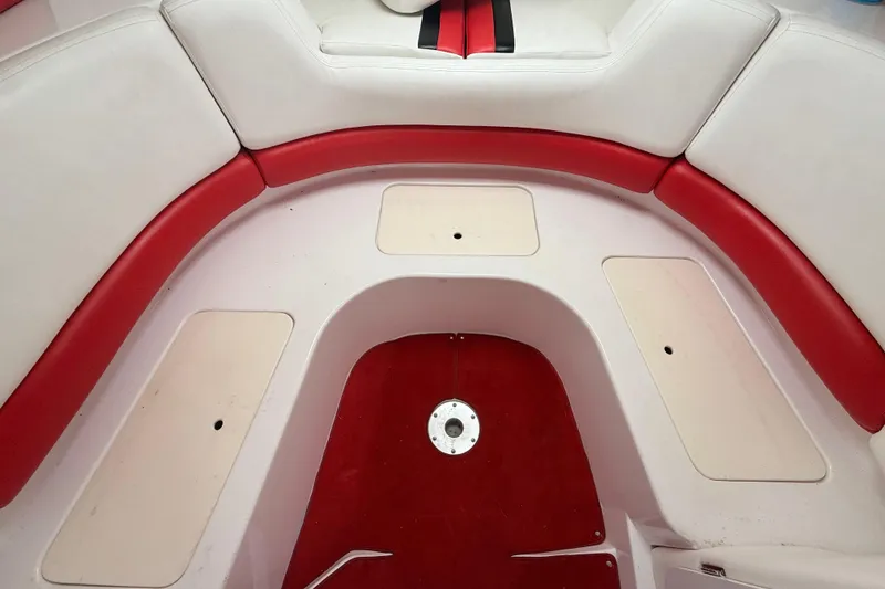 Slide: The Image of Interior seating of a 1998 Donzi 33 ZX boat with red and white upholstery. - 32