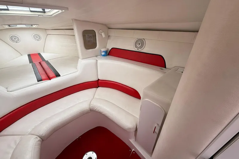 Slide: The Image of Interior of a 1998 Donzi 33 ZX boat with red and white seating. - 33