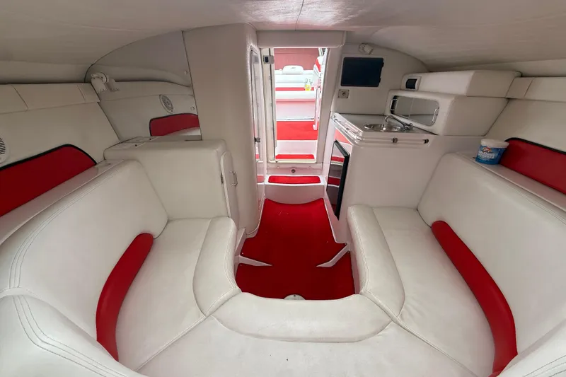 Slide: The Image of Interior of a 1998 Donzi 33 ZX boat with white and red seating. - 39