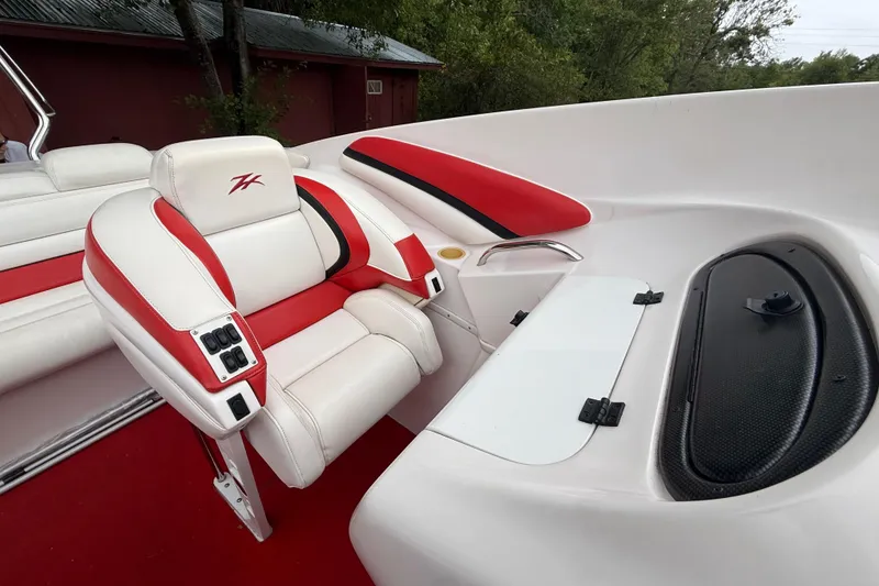 Slide: The Image of 1998 Donzi 33 ZX boat interior with red and white seating and control panel. - 60