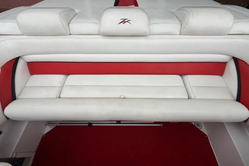 Slide: The Image of 1998 Donzi 33 ZX boat interior with white and red seating. - 63
