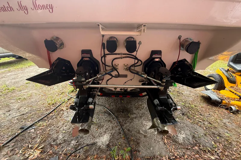 Slide: The Image of Rear view of a 1998 Donzi 33 ZX boat showing dual outboard motors and propellers. - 71