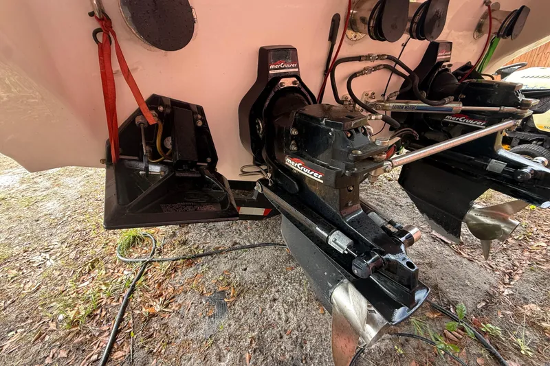 Slide: The Image of 1998 Donzi 33 ZX boat stern with MerCruiser outdrives and propellers. - 72