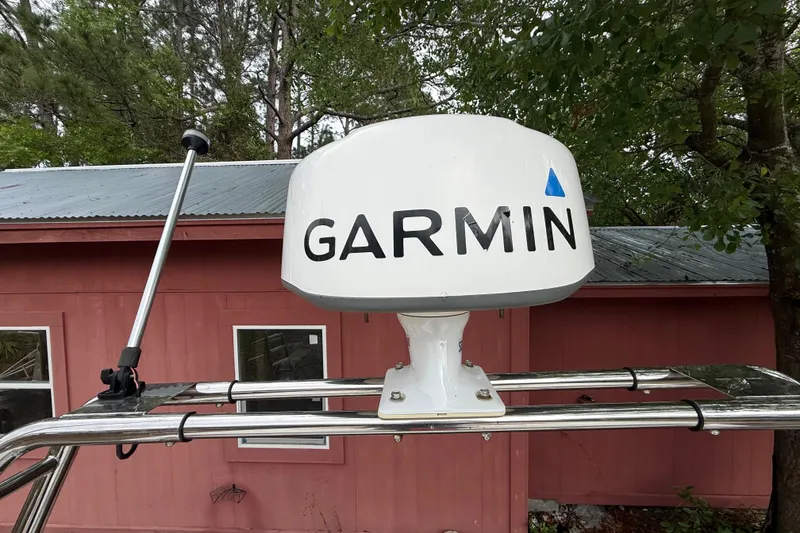 Slide: The Image of Garmin radar on 1998 Donzi 33 ZX boat, mounted near a red building. - 79