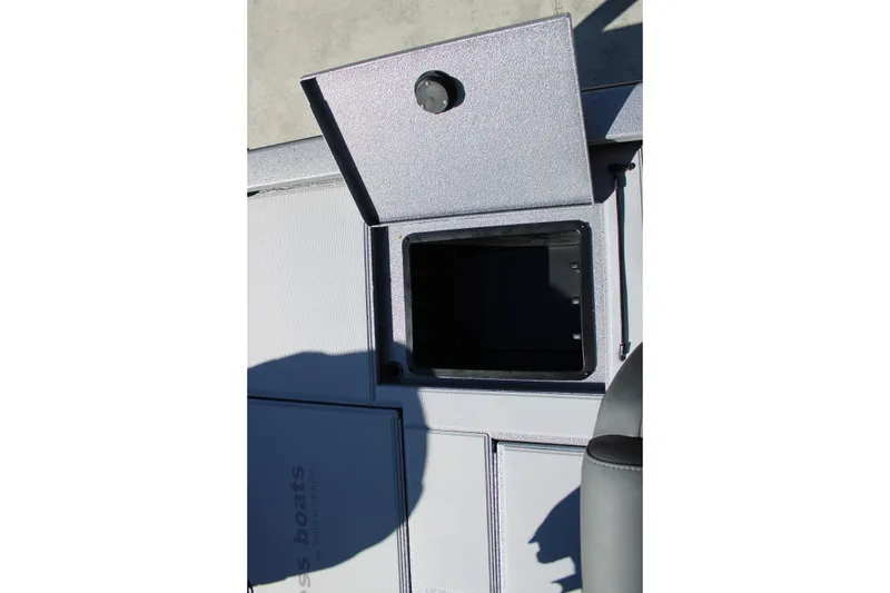 Slide: The Image of Open storage compartment on 2026 Xpress H20 boat deck. - 11
