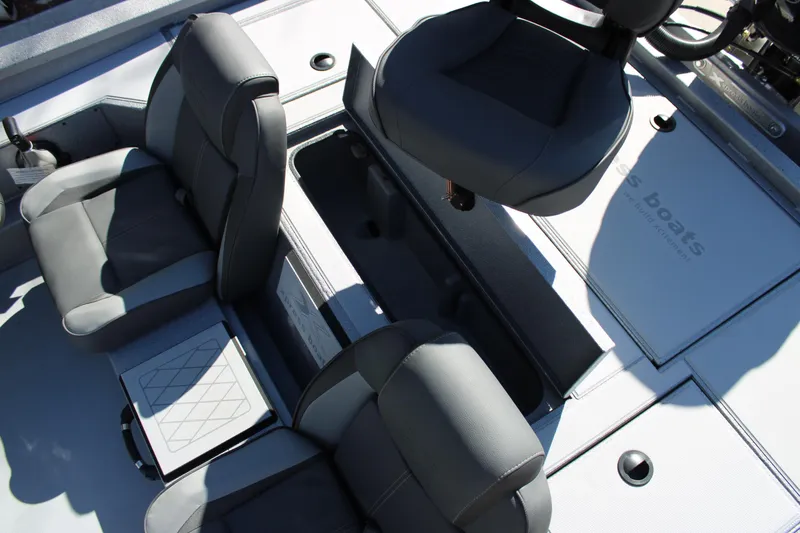 Slide: The Image of 2026 Xpress H20 boat interior with gray seating and storage compartments. - 12