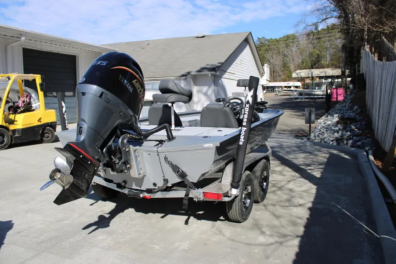 Slide: The Image of 2026 Xpress H20 boat with Yamaha outboard motor on a trailer. - 3