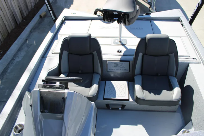 Slide: The Image of 2026 Xpress H20 boat interior with dual seats and steering console. - 8