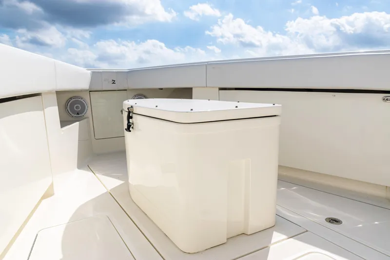 Slide: The Image of 2018 SeaVee 370Z boat deck with storage box under a blue sky. - 10
