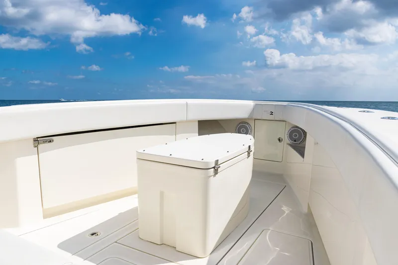 Slide: The Image of 2018 SeaVee 370Z boat deck with storage, under a clear blue sky. - 13
